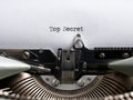 The word top secret written with a vintage typewriter. Confidential classified document, secrecy and information concept