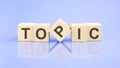 word topic on wooden cubes on blue light background