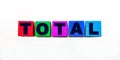 The word TOTAL is written on colorful cubes on a light background