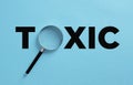 The word toxic with magnifier