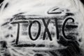 Word Toxic written in and with sugar, capital letters, health co