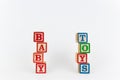 The Word Toy and Baby in Wooden Childrens Blocks Royalty Free Stock Photo