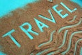 The word travel is written on the sand Royalty Free Stock Photo
