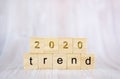The word trend and 2020 on wooden cube block. 2020 trend concept Royalty Free Stock Photo