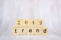 The word trend and 2019 on wooden cube block. 2019 trend concept Royalty Free Stock Photo