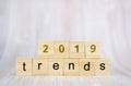 The word trends and 2019 on wooden cube block. 2019 trend concept Royalty Free Stock Photo