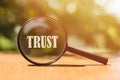 The word TRUST on magnifier in sunlight Royalty Free Stock Photo