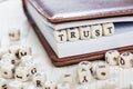 Word TRUST on old wooden table. Royalty Free Stock Photo