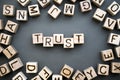 The word trust wooden cubes with burnt letters Royalty Free Stock Photo