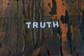 The word truth written in white block letters