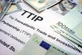 Word TTIP on a paper with dollars. Royalty Free Stock Photo