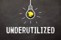 word Underutilized on black background, concept business Royalty Free Stock Photo
