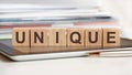 The word unique is written on wooden cubes, concept