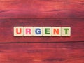 Word Urgent on wood