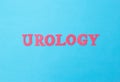 Word urology in red letters on a blue background. Sociology of the section of medicine that treats kidney and prostate diseases Royalty Free Stock Photo