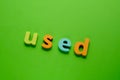 Word USED on green background. Learning the English alphabet and language.The concept of education, school, kindergarten