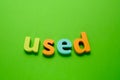 Word USED on green background. Learning the English alphabet and language.The concept of education, school, kindergarten