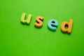 Word USED on green background. Learning the English alphabet and language.The concept of education, school, kindergarten