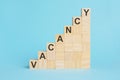 the word VACANCY is written on a wooden cubes, concept