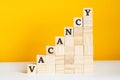 the word vacancy is written on a wooden cubes, concept