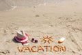 Word vacation, accessories for sunbathing and passport with currencies dollar at beach, summer time Royalty Free Stock Photo