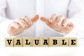 The word - Valuable- on wooden cubes Royalty Free Stock Photo