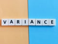 The word variance is composed of square letter tiles