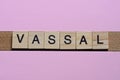 word vassal from small gray wooden letters Royalty Free Stock Photo