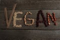 The word vegan written plant foods: beans, nuts. go vegan