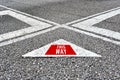 The word this way written on asphalt road with direction arrows Royalty Free Stock Photo