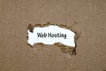 The word web hosting appearing behind torn paper Royalty Free Stock Photo