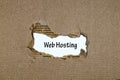 The word web hosting appearing behind torn paper Royalty Free Stock Photo
