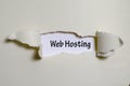 The word web hosting appearing behind torn paper Royalty Free Stock Photo