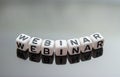 Word webinar from letter cubes on smartphone Royalty Free Stock Photo