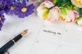 Word wedding on calendar with sweet flowers