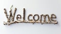 The word Welcome isolated on white background made in Birch Twig Letters style. Royalty Free Stock Photo