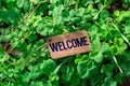 The word welcome wooden tag