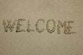 Word welcome written on the sand as the background Royalty Free Stock Photo