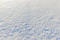 Word welcome written on the snow Royalty Free Stock Photo