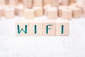 The Word WIFI Formed By Wooden Blocks On A White Table