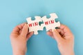 The word win is standing on puzzle parts, problem solving, winner mindset, business and education concept, coaching and motivation Royalty Free Stock Photo