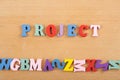 PROJECT word on wooden background composed from colorful abc alphabet block wooden letters, copy space for ad text. Learning Royalty Free Stock Photo