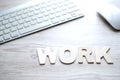 The word WORK, Wooden letters on the computer table Royalty Free Stock Photo
