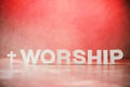 Word Worship made with cement letters on red marble background. Copy space. Biblical, spiritual or christian reminder