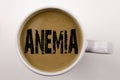 Word, writing Anemia text in coffee in cup. Business concept for Medical Diagnosis Iron deficiency aplastic on white background wi