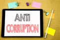 Word, writing Anti Corruption. Business concept for Bribery Corrupt Text Written on tablet laptop, wooden background with sticky n Royalty Free Stock Photo
