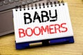 Word, writing Baby Boomers. Business concept for Demographic Generation written on notebook book on the wooden background in the O Royalty Free Stock Photo