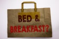 Word, writing Bed Breakfast. Business concept for Holiday Journey Travel Written on shopping bag, white isolated background.
