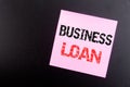 Word, writing Business Loan. Business concept for Lending Finance Credit written on sticky note, black background with copy space