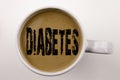 Word, writing Diabetes text in coffee in cup. Business concept for Disease Medical Insulin on white background with copy space